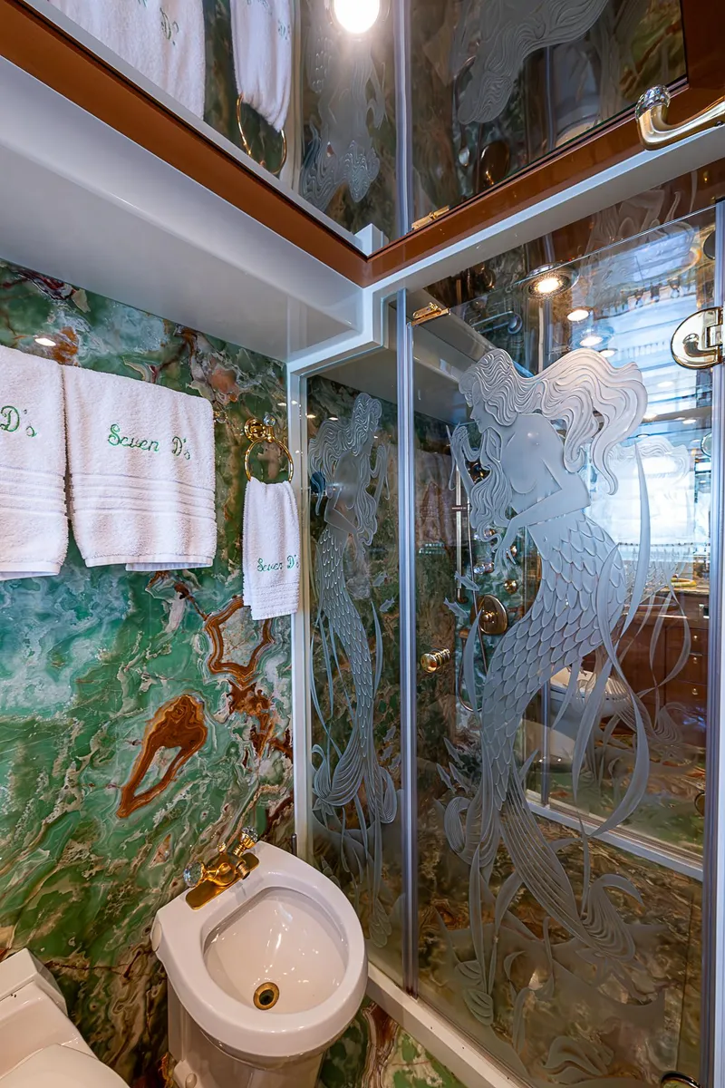 Slide: The Image of Luxurious bathroom in 2013 Johnson 78 Cockpit Motoryacht with etched glass shower and marble decor. - 42