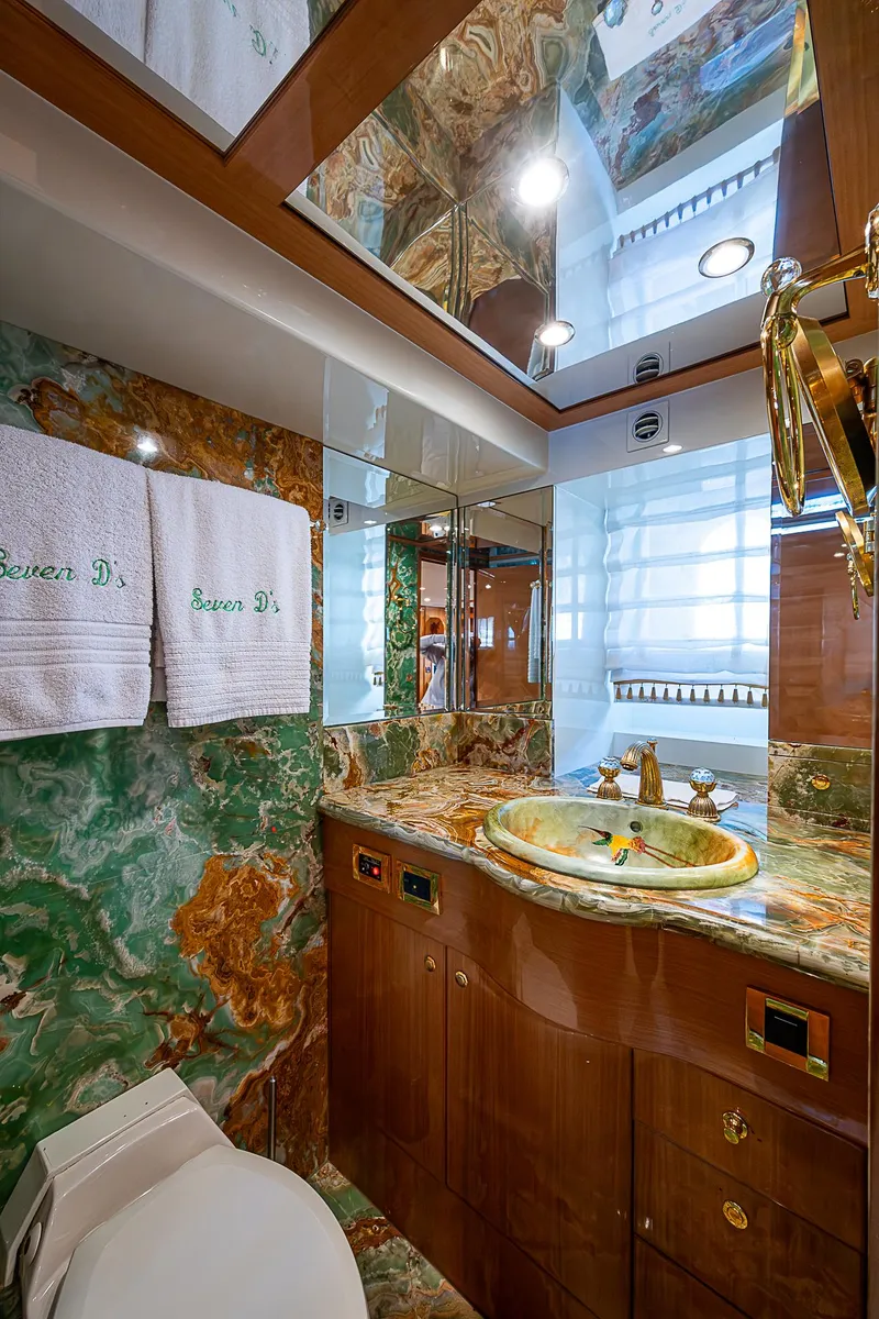 Slide: The Image of Luxurious bathroom in 2013 Johnson 78 Cockpit Motoryacht with marble accents and elegant fixtures. - 43