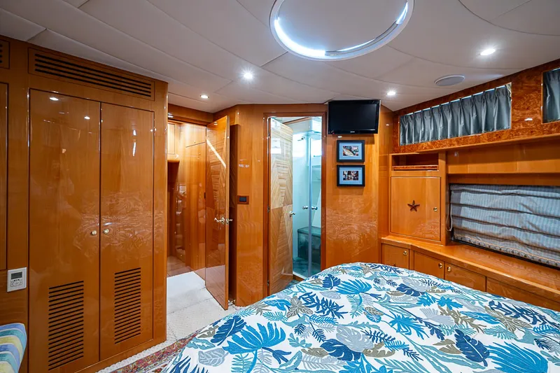 Slide: The Image of Luxurious cabin interior of 2013 Johnson 78 Cockpit Motoryacht with wood finishes and modern amenities. - 48