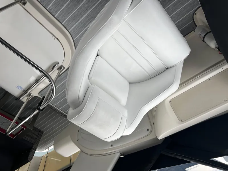 Slide: The Image of 1995 Cruisers Yachts 3650 ACMY interior with white seating and modern design. - 31