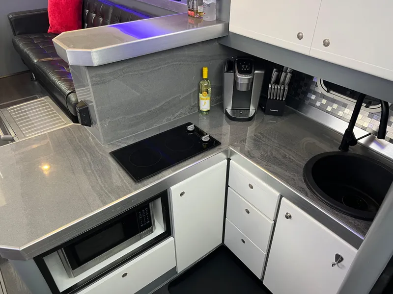Slide: The Image of Modern kitchen in 1995 Cruisers Yachts 3650 ACMY with sleek countertops and appliances. - 50
