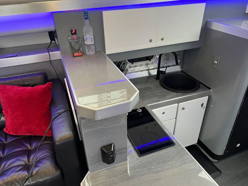 Slide: The Image of Interior of 1995 Cruisers Yachts 3650 ACMY with modern kitchen and seating area. - 52