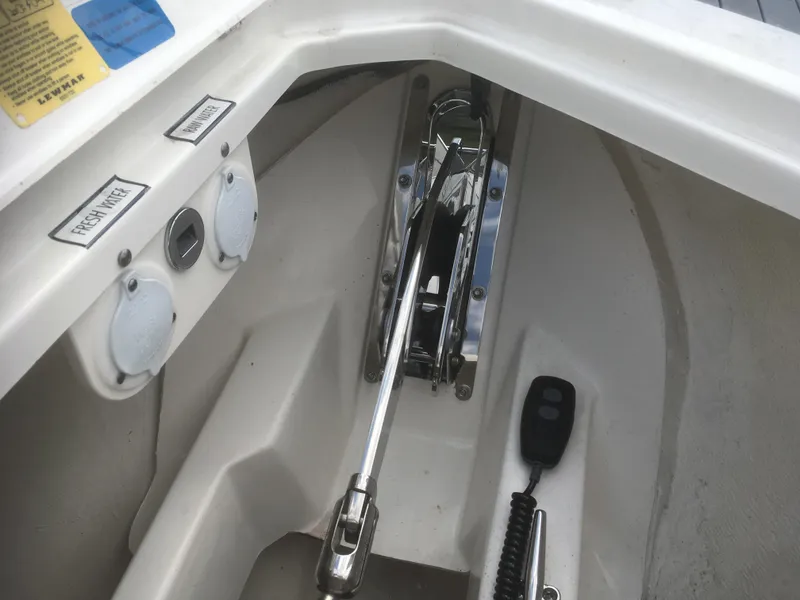 Slide: The Image of Anchor winch system on a 2025 Pursuit DC 326 Dual Console boat. - 9