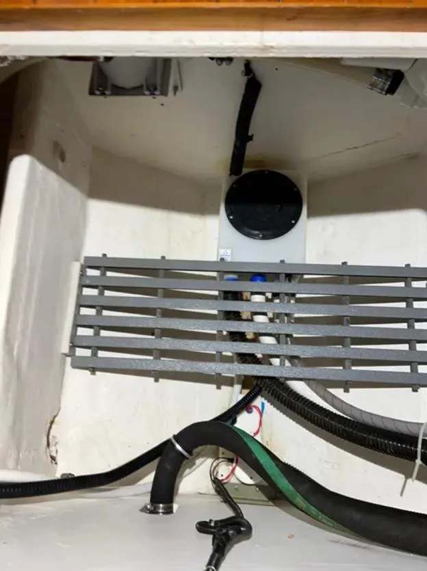 Slide: The Image of Engine compartment of 1999 Tiara Yachts 4100 Open, showing hoses and components. - 13