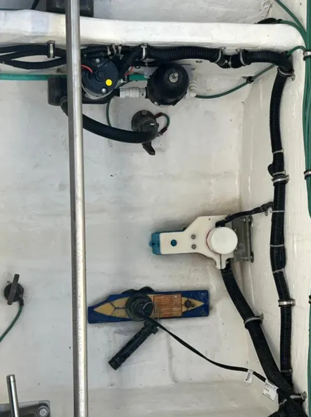 Slide: The Image of Engine compartment of 1999 Tiara Yachts 4100 Open, showing wiring and components. - 14