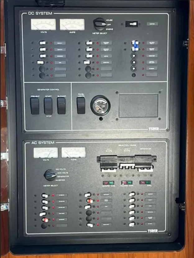 Slide: The Image of Electrical panel of a 1999 Tiara Yachts 4100 Open, showing DC and AC systems. - 16