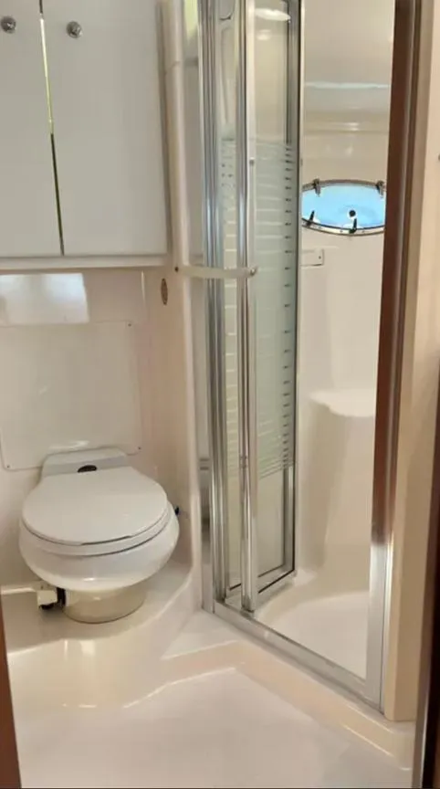 Slide: The Image of Bathroom interior of 1999 Tiara Yachts 4100 Open with shower and toilet. - 20