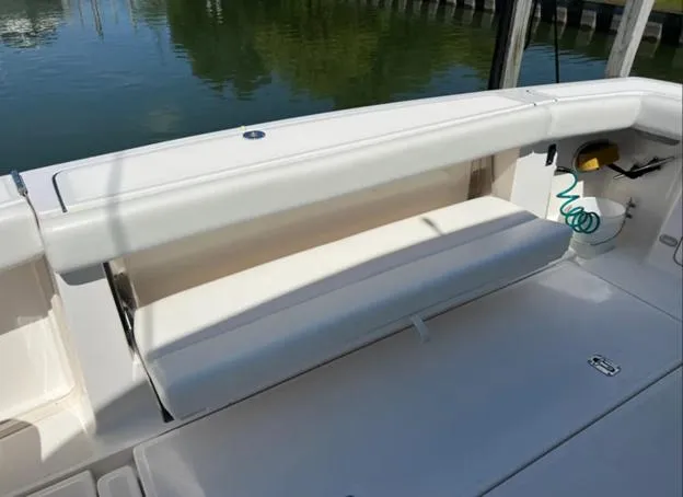 Slide: The Image of 1999 Tiara Yachts 4100 Open boat seating area with white cushions. - 6