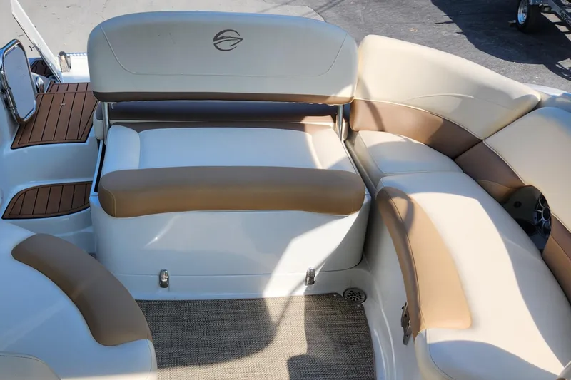 Slide: The Image of 2017 Crownline Eclipse E4 boat interior with beige and brown seating, featuring a stylish design. - 10