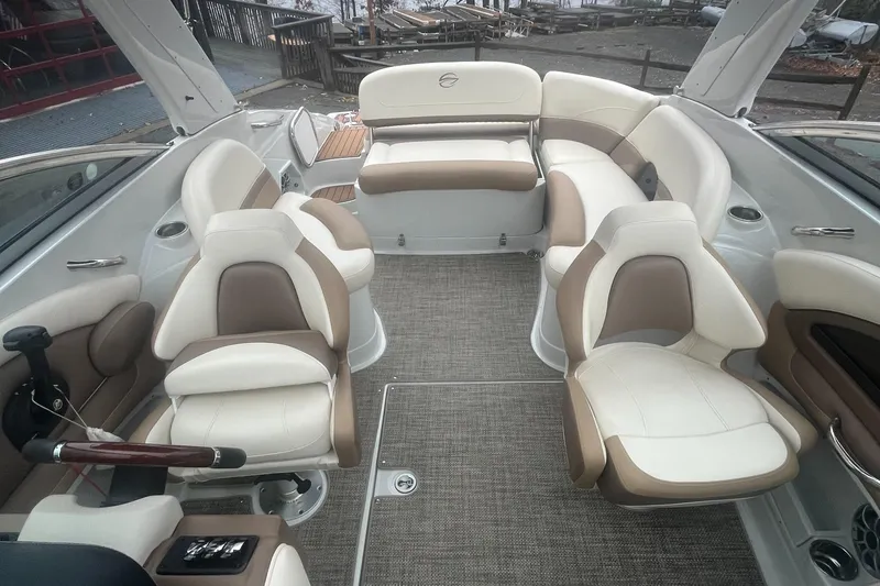Slide: The Image of 2017 Crownline Eclipse E4 boat interior with beige and white seating arrangement. - 12