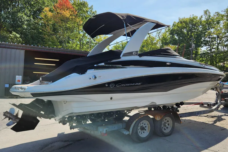 Slide: The Image of 2017 Crownline Eclipse E4 boat on trailer, parked outdoors. - 4