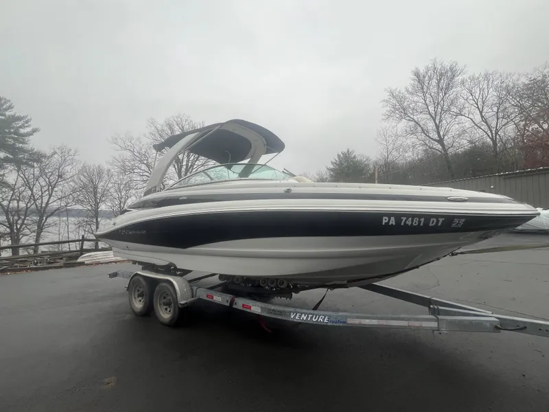 Slide: The Image of 2017 Crownline Eclipse E4 boat on trailer, parked outdoors on a cloudy day. - 5