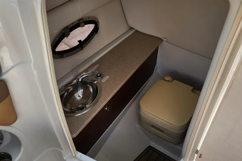 Slide: The Image of 2017 Crownline Eclipse E4 boat interior with sink and portable toilet. - 9