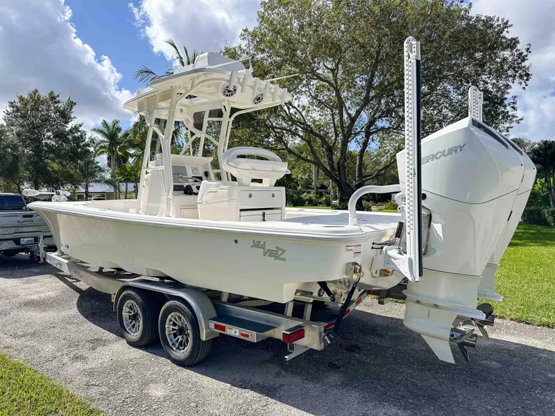 Slide: The Image of 2022 SeaVee 270Z boat on trailer, featuring a powerful Mercury outboard engine. - 1