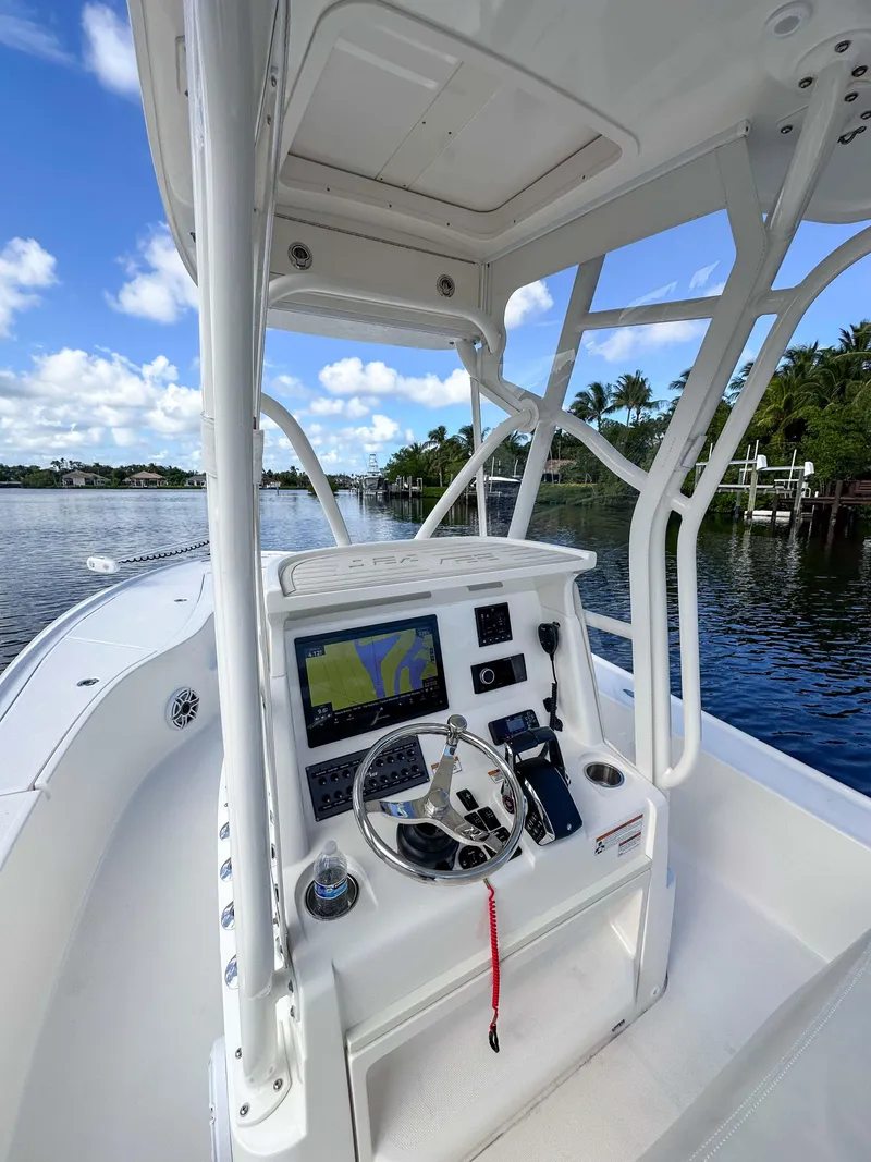 Slide: The Image of 2022 SeaVee 270Z boat console with navigation system on a sunny day. - 14