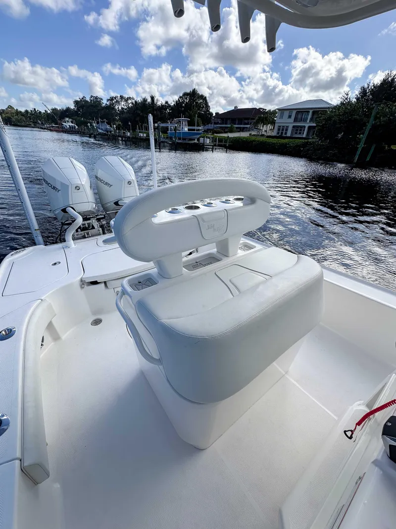 Slide: The Image of 2022 SeaVee 270Z boat with dual engines on a scenic waterway. - 26