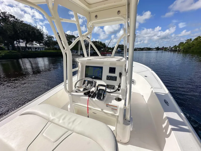 Slide: The Image of 2022 SeaVee 270Z boat interior with steering console on a sunny day. - 33