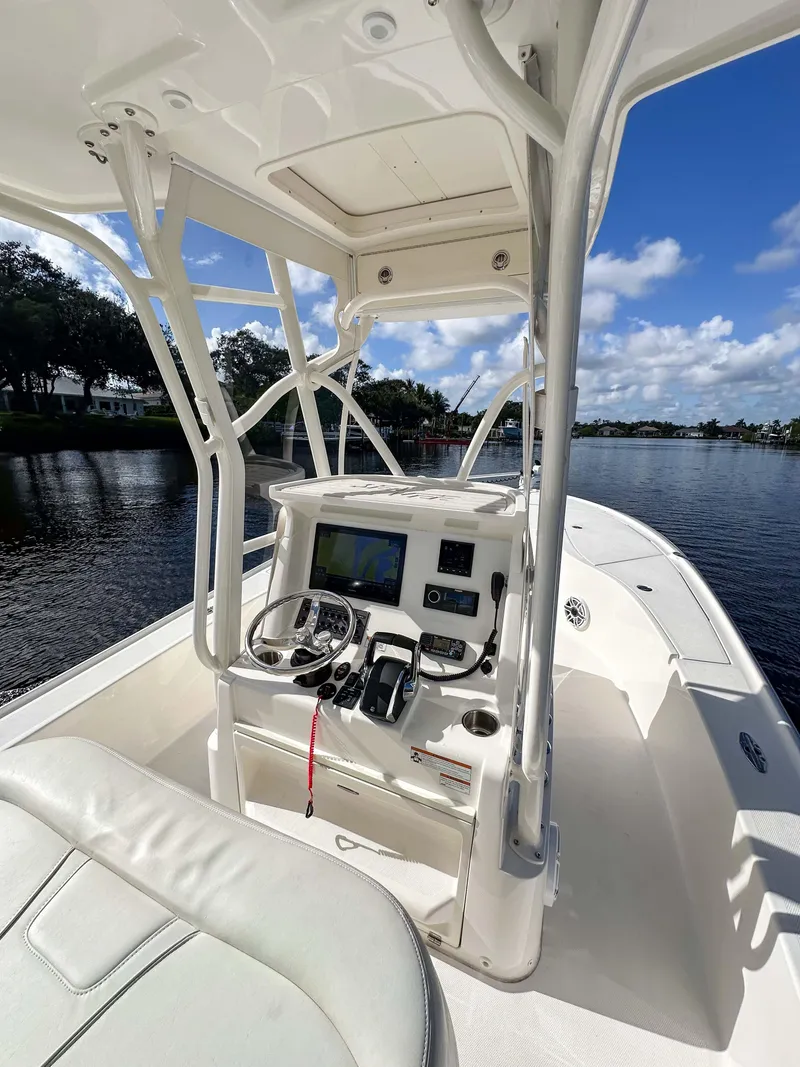 Slide: The Image of 2022 SeaVee 270Z boat interior with modern console on a sunny day. - 34
