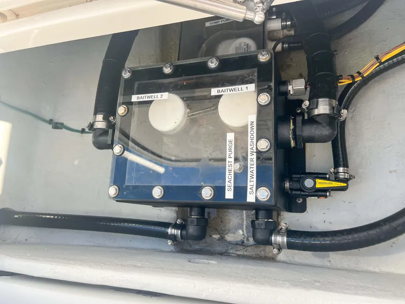 Slide: The Image of SeaVee 270Z 2022 boat plumbing system with labeled baitwell and saltwater connections. - 38