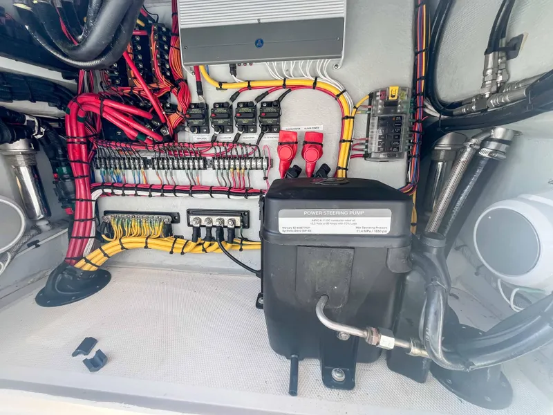 Slide: The Image of Electrical system of a 2022 SeaVee 270Z boat, showcasing organized wiring and components. - 39