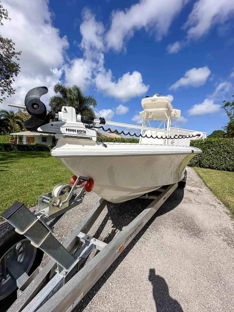 Slide: The Image of 2022 SeaVee 270Z boat on trailer under blue sky with clouds. - 8