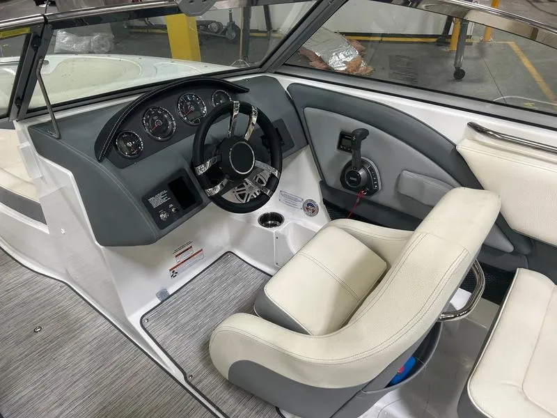 Slide: The Image of Interior of 2022 Cobalt 220S boat, featuring steering wheel and dashboard controls. - 3