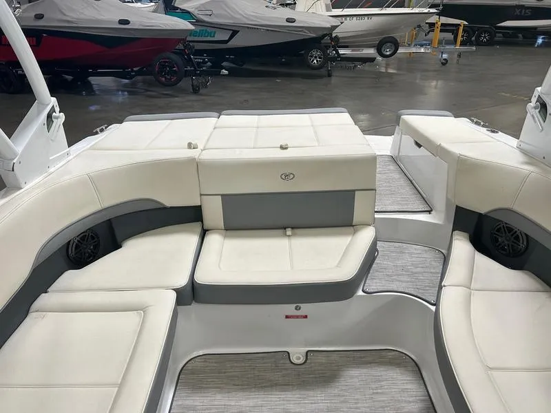 Slide: The Image of 2022 Cobalt 220S boat interior with white seating and modern design. - 4