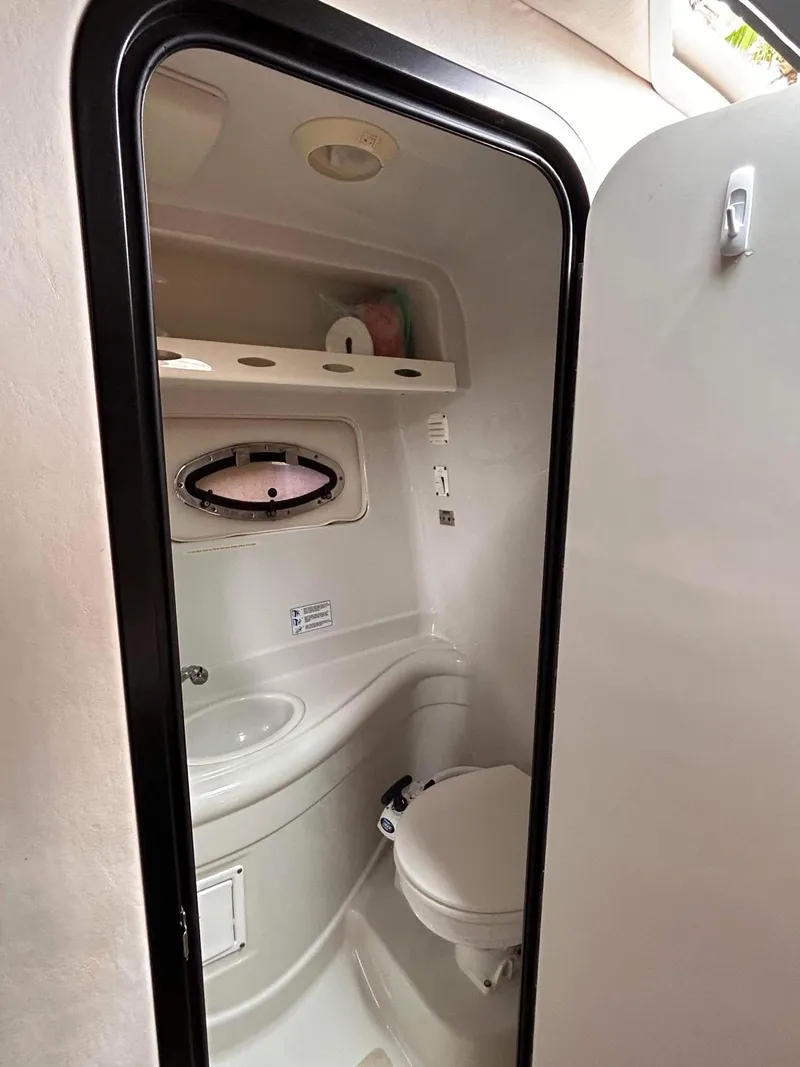 Slide: The Image of 2007 Crownline 270 CR boat bathroom interior with sink and toilet. - 12