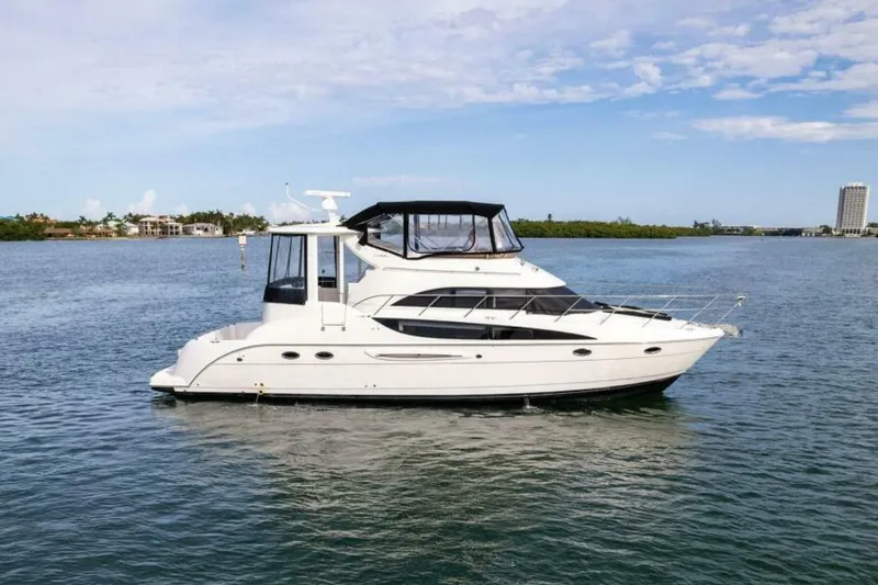 Slide: The Image of 2008 Meridian 459 Motoryacht on calm water under a clear sky. - 1