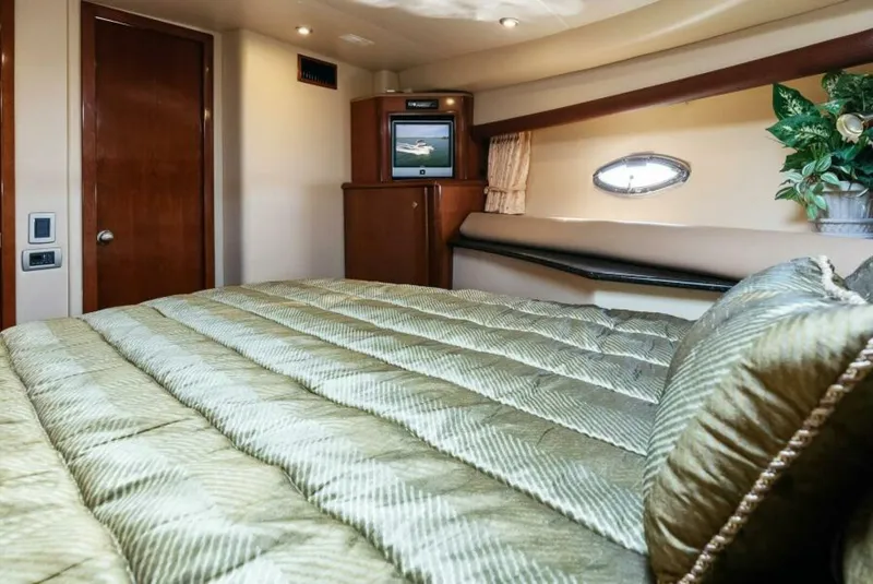 Slide: The Image of Luxurious bedroom interior of 2008 Meridian 459 Motoryacht with TV and porthole. - 13