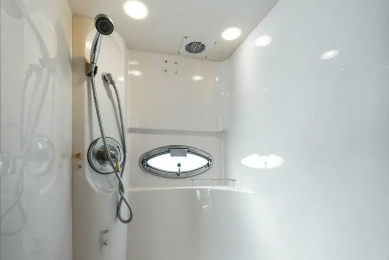 Slide: The Image of Shower area in 2008 Meridian 459 Motoryacht, featuring modern fixtures and porthole window. - 15