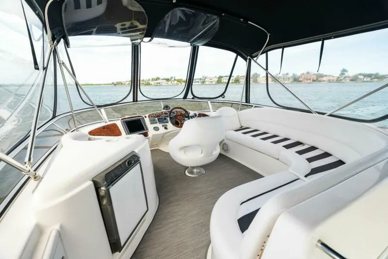 Slide: The Image of 2008 Meridian 459 Motoryacht interior with helm, seating, and panoramic windows. - 19