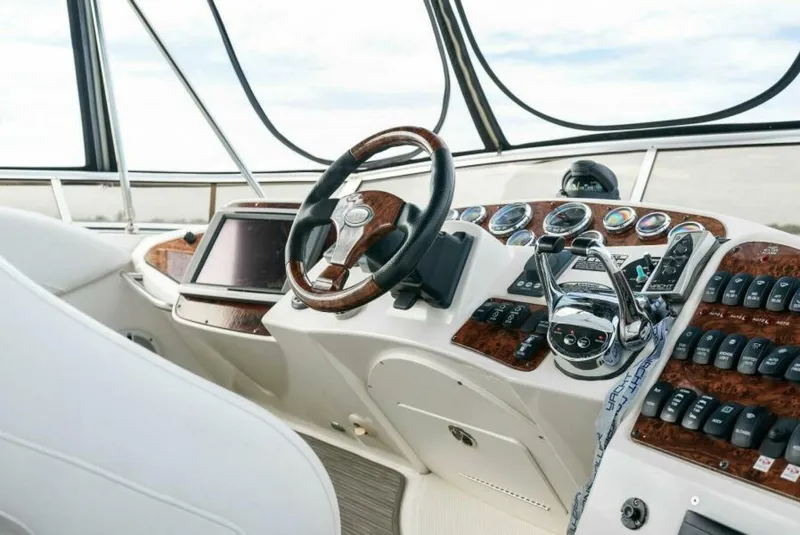 Slide: The Image of Helm of 2008 Meridian 459 Motoryacht with wood accents and modern controls. - 21