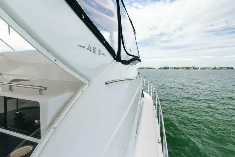 Slide: The Image of 2008 Meridian 459 Motoryacht cruising on open water under a partly cloudy sky. - 25