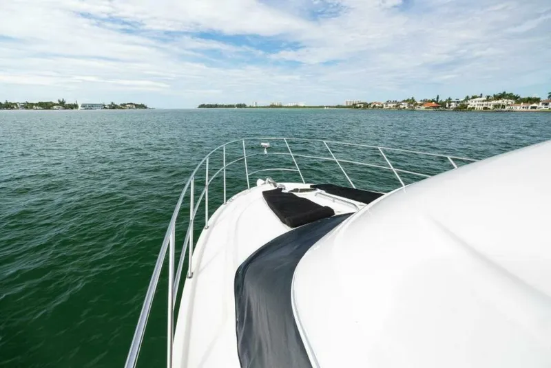 Slide: The Image of 2008 Meridian 459 Motoryacht cruising on open water under a clear sky. - 26