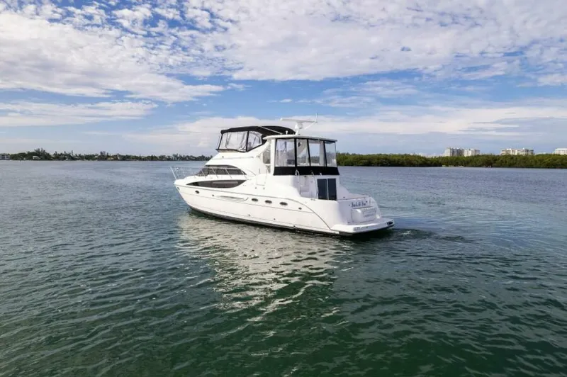 Slide: The Image of 2008 Meridian 459 Motoryacht on calm water under a partly cloudy sky. - 34