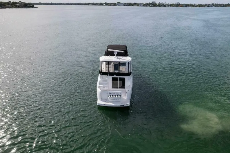Slide: The Image of 2008 Meridian 459 Motoryacht on calm water, rear view. - 39