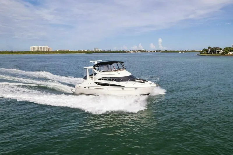 Slide: The Image of 2008 Meridian 459 Motoryacht cruising on open water under a clear sky. - 40