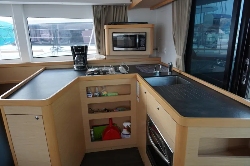 Slide: The Image of Modern kitchen interior of 2017 Lagoon 42 catamaran with appliances and storage. - 7