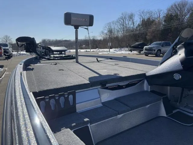 Slide: The Image of 2025 Phoenix 721 ZXL boat, spacious deck, parked outdoors, winter setting. - 11