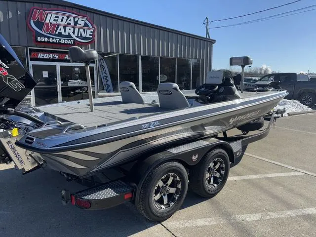 Slide: The Image of 2025 Phoenix 721 ZXL boat at Weda's Marine dealership, parked on a trailer. - 3