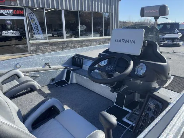 Slide: The Image of 2025 Phoenix 721 ZXL boat interior with Garmin navigation system and dual seating. - 4