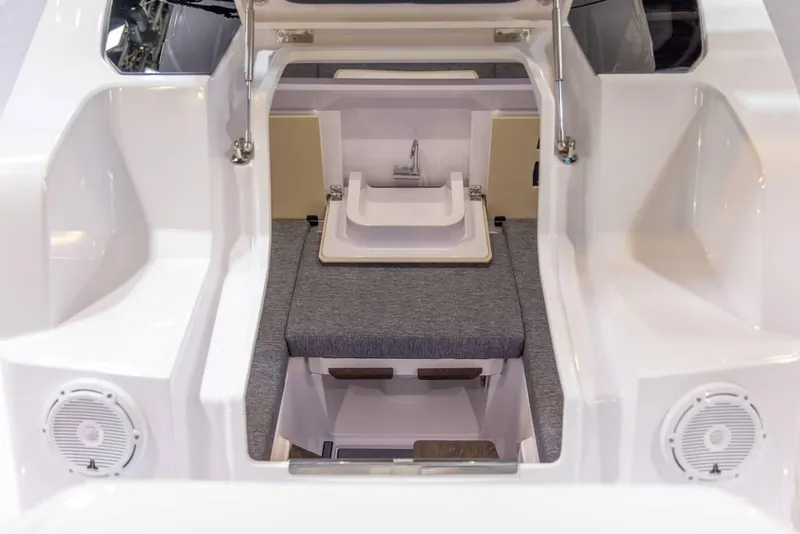 Slide: The Image of 2025 Axopar 29 XC Cross Cabin interior with seating and sink. - 14