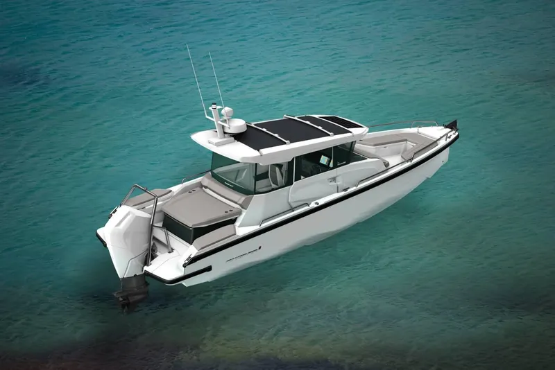 Slide: The Image of 2025 Axopar 29 XC Cross Cabin boat on clear turquoise water. - 15