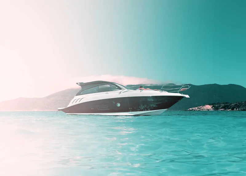 Slide: The Image of 2025 Hanover 355 Outboard boat on serene turquoise water, scenic mountain backdrop. - 3