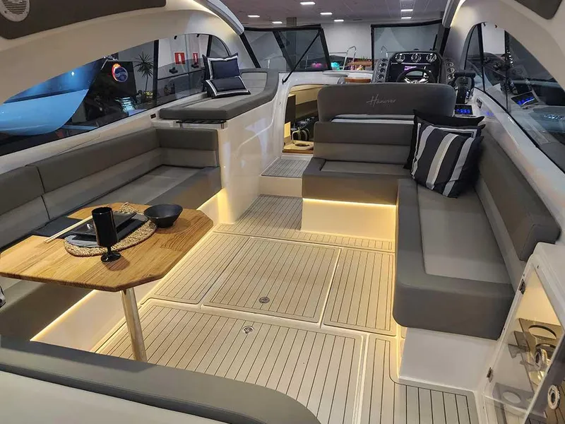 Slide: The Image of Luxurious interior of 2025 Hanover 355 Outboard boat with elegant seating and ambient lighting. - 4