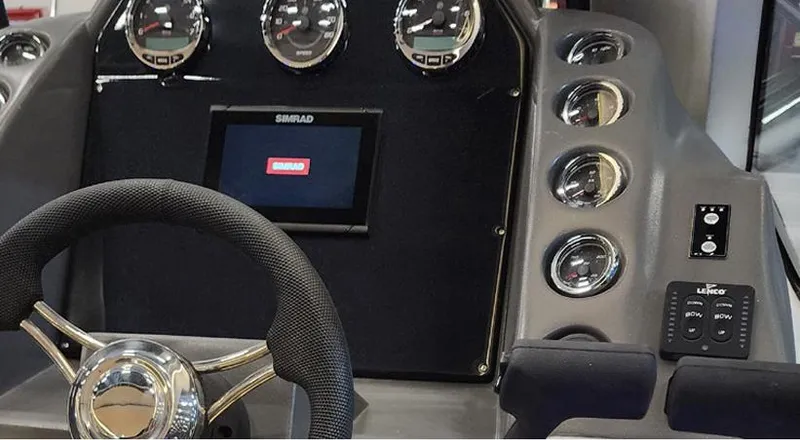 Slide: The Image of Dashboard of 2025 Hanover 355 Outboard boat with steering wheel and gauges. - 5