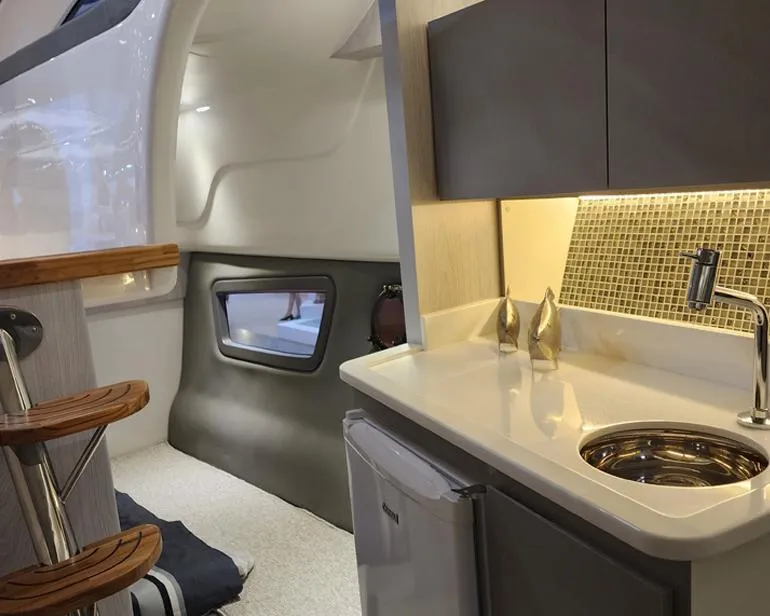 Slide: The Image of Interior of 2025 Hanover 355 Outboard boat with kitchenette and modern design. - 8