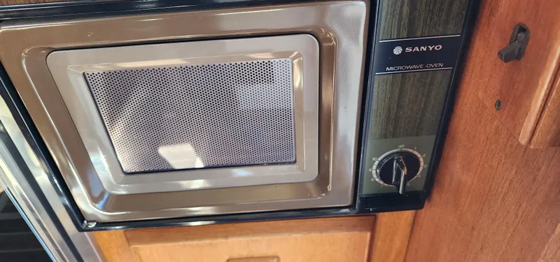Slide: The Image of Sanyo microwave oven in 1985 Bertram 33 Flybridge Cruiser kitchen. - 16