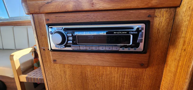 Slide: The Image of Built-in stereo system on 1985 Bertram 33 Flybridge Cruiser, wooden interior detail. - 24